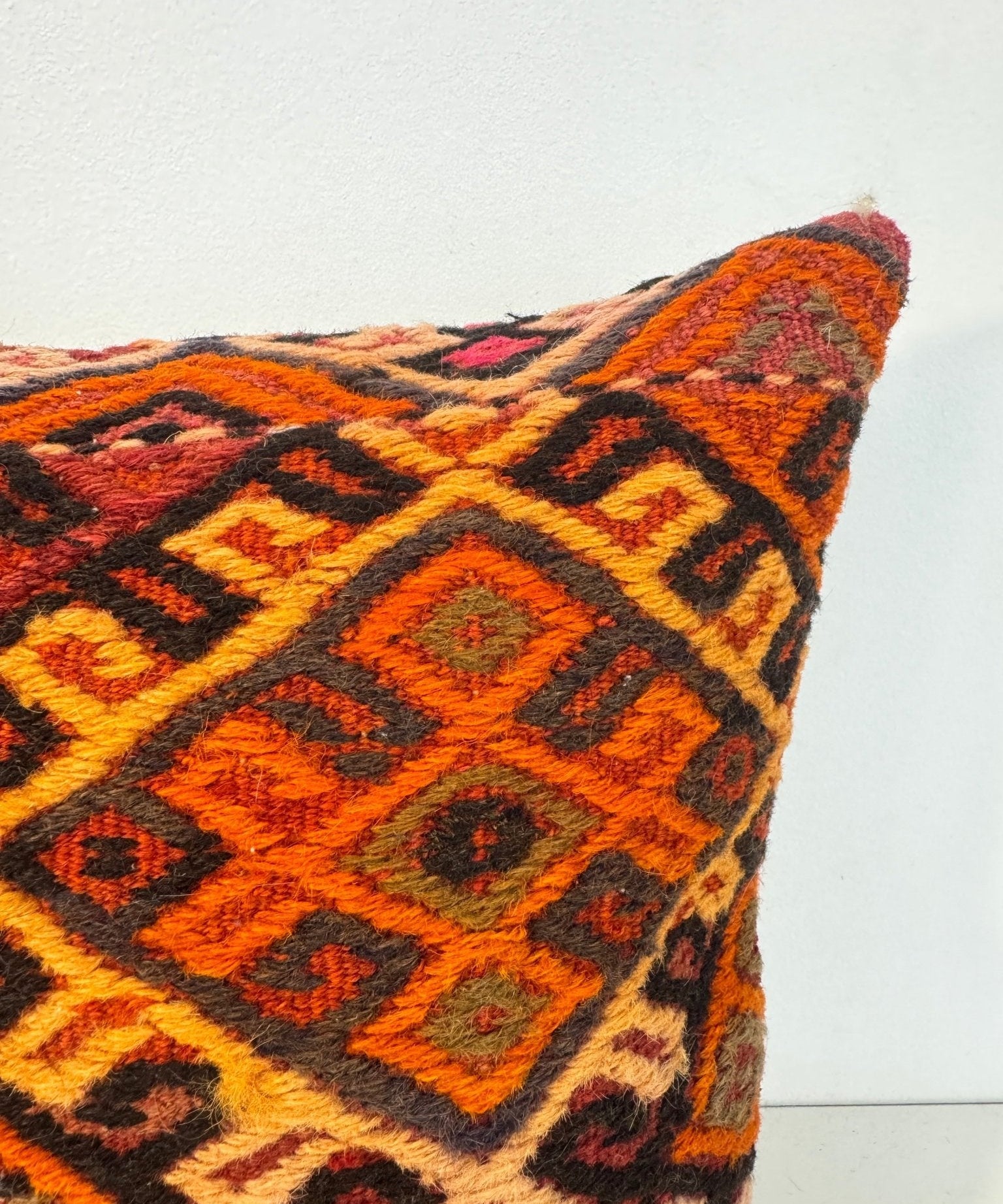16 x 16 throw pillow cover with multicolor geometric diamond pattern on the corner