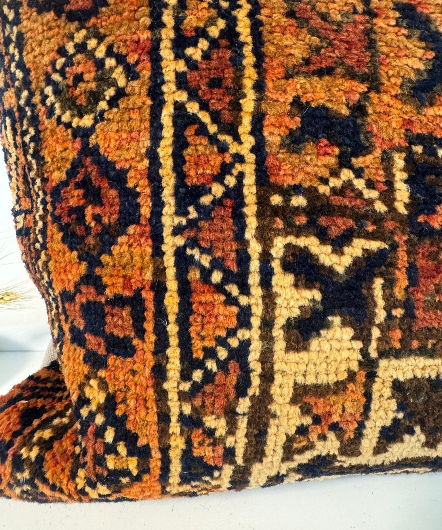Decorative throw pillow, 18x18, front view with multicolor geometric woven pattern and dark border