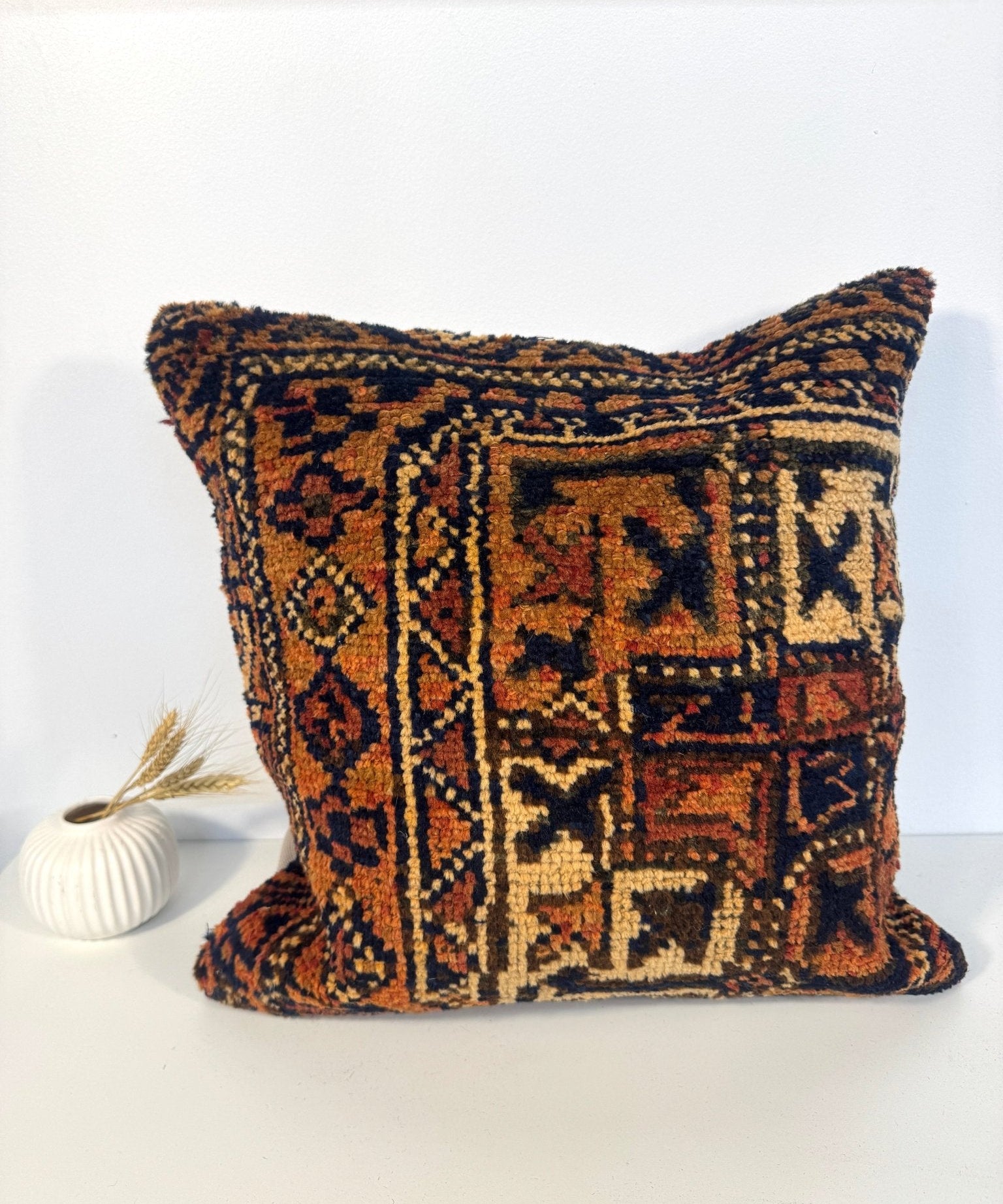Decorative throw pillow, 18x18, full front view with multicolor woven geometric pattern