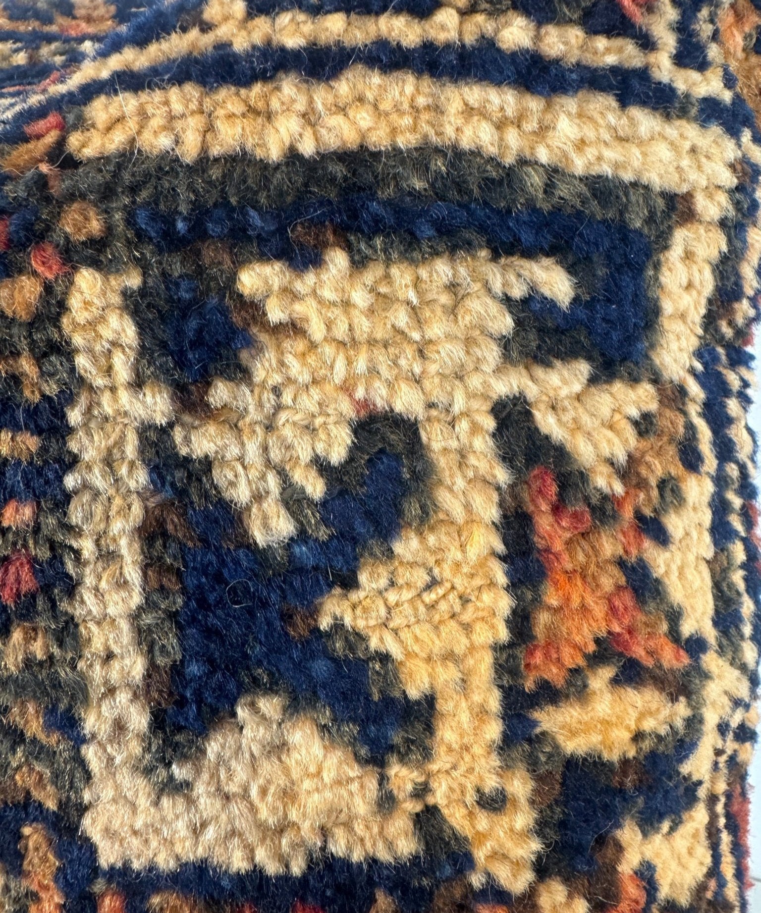Decorative throw pillow, 18x18, detailed woven square pattern in cream, navy, and orange tones