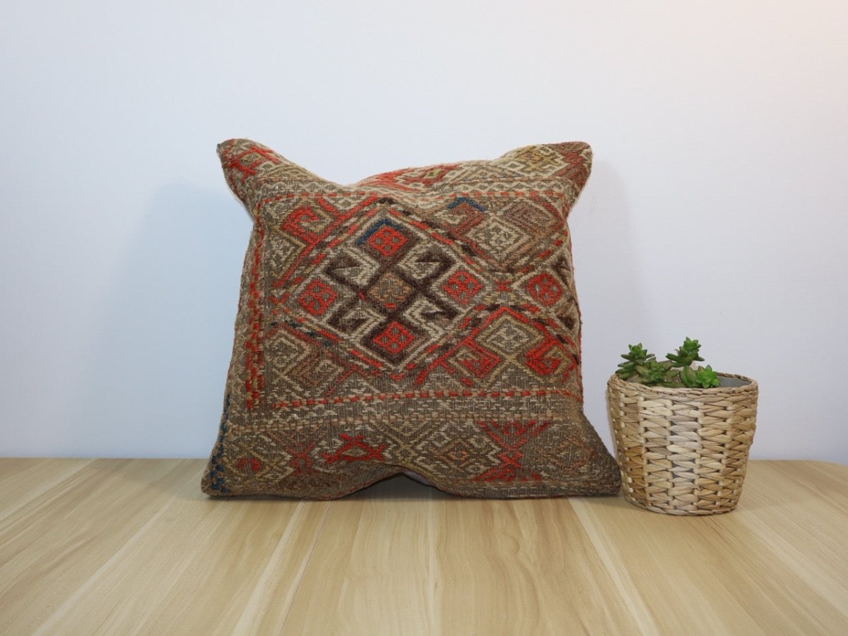 18x18 decorative pillow with multicolor diamond pattern and stitched edges