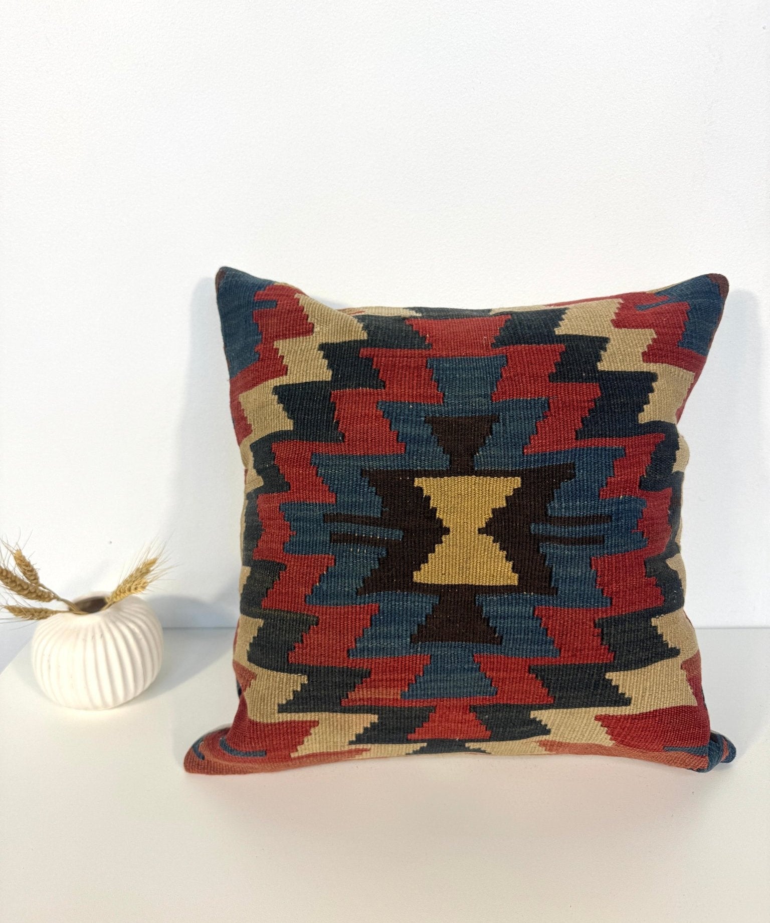 16 x 16 in decorative pillow with multicolor geometric pattern on front and plain back