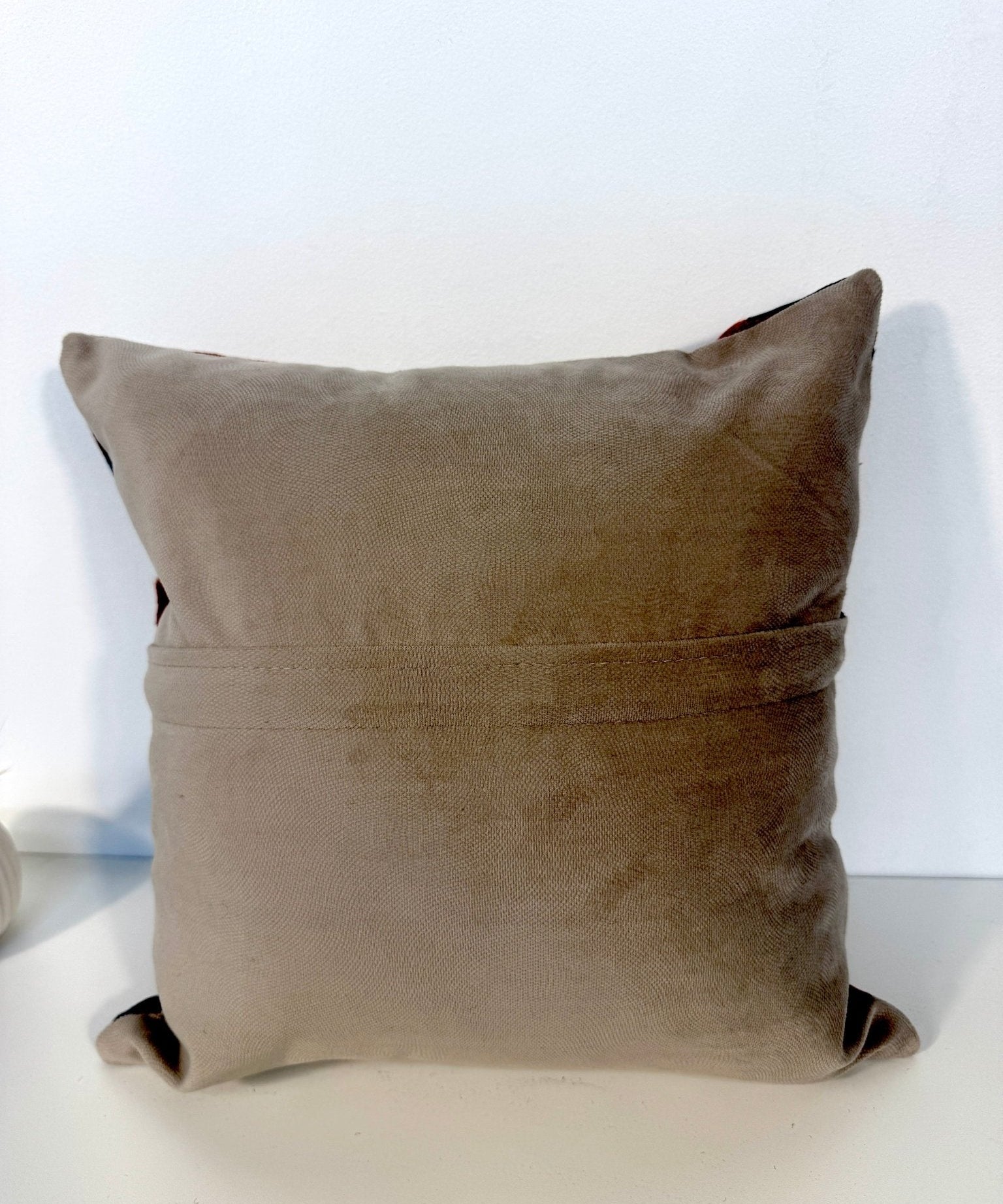 16 x 16 in decorative pillow with solid taupe back and hidden zipper closure