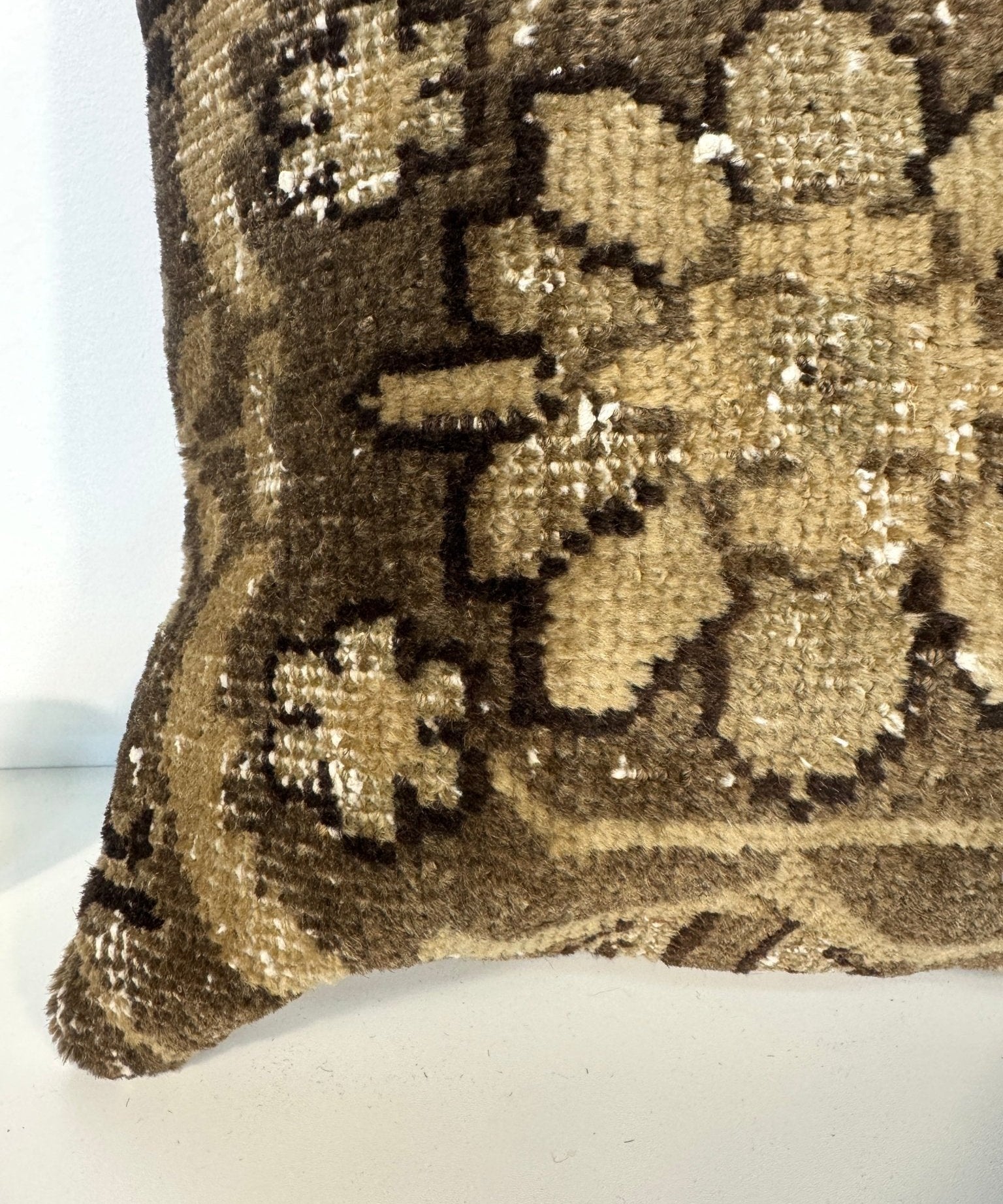 Gold and dark abstract floral pattern throw pillow, close-up texture