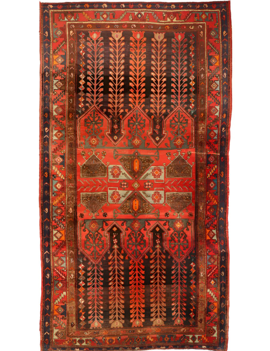 Vintage geometric area rug with red background, navy accents, and central medallion design