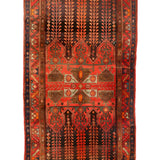 Vintage geometric area rug with red background, navy accents, and central medallion design