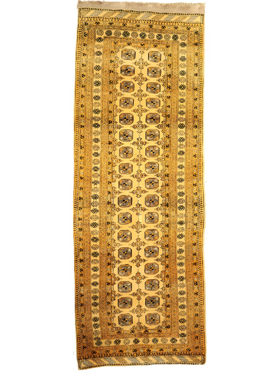Afghan Bokhara runner rug full view in gold with black medallion column and border