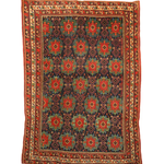 Antique Afshar rug flat view: dark blue, red and green diamond motifs with cream border