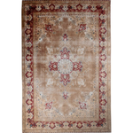 Ivory Tabriz-style area rug with red and blue corner ornaments and center medallion.