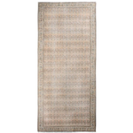 Rectangular beige paisley rug with central field of repeating motifs and patterned border