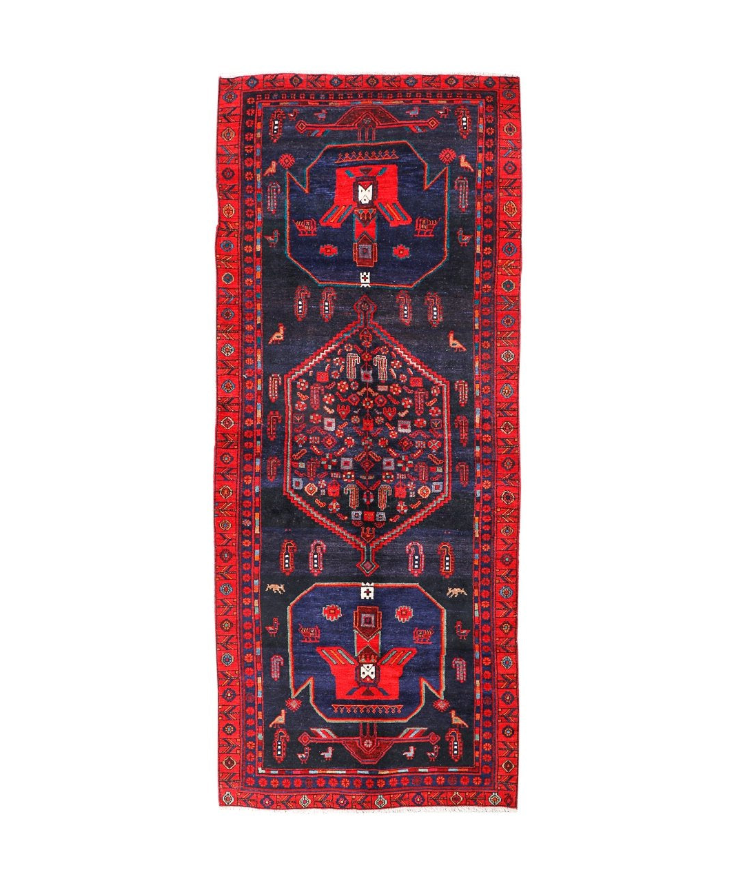 Kurdish Koliai rug, dark navy field with red border and central geometric medallion.