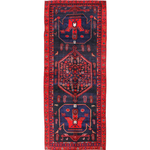 Kurdish Koliai rug, dark navy field with red border and central geometric medallion.