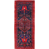 Kurdish Koliai rug, dark navy field with red border and central geometric medallion.