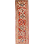 Persian-style runner rug with red field and geometric cream medallion motifs