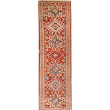 Persian-style runner rug with red field and geometric cream medallion motifs