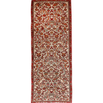 Persian Bidjar runner rug with cream field, red border, and ornate red medallion pattern.