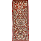 Persian Bidjar runner rug with cream field, red border, and ornate red medallion pattern.