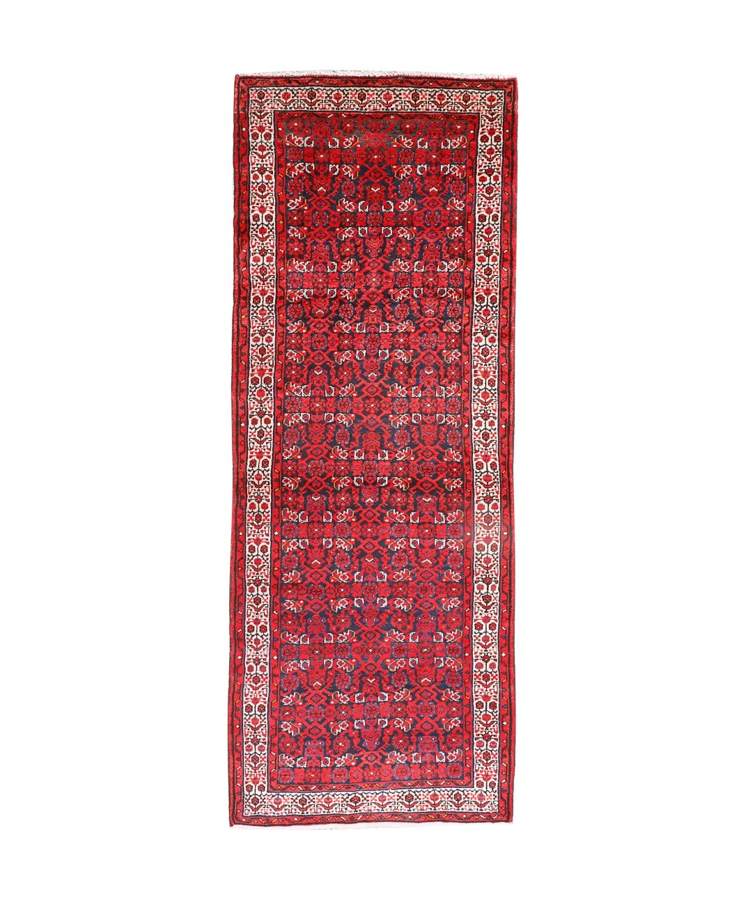 Persian runner rug studio view with dark red central motif, cream frame, and thin fringe.
