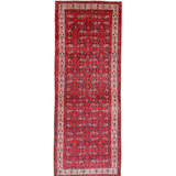 Persian runner rug studio view with dark red central motif, cream frame, and thin fringe.
