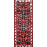 Persian runner rug with dark red medallion pattern, black field, cream border stripes