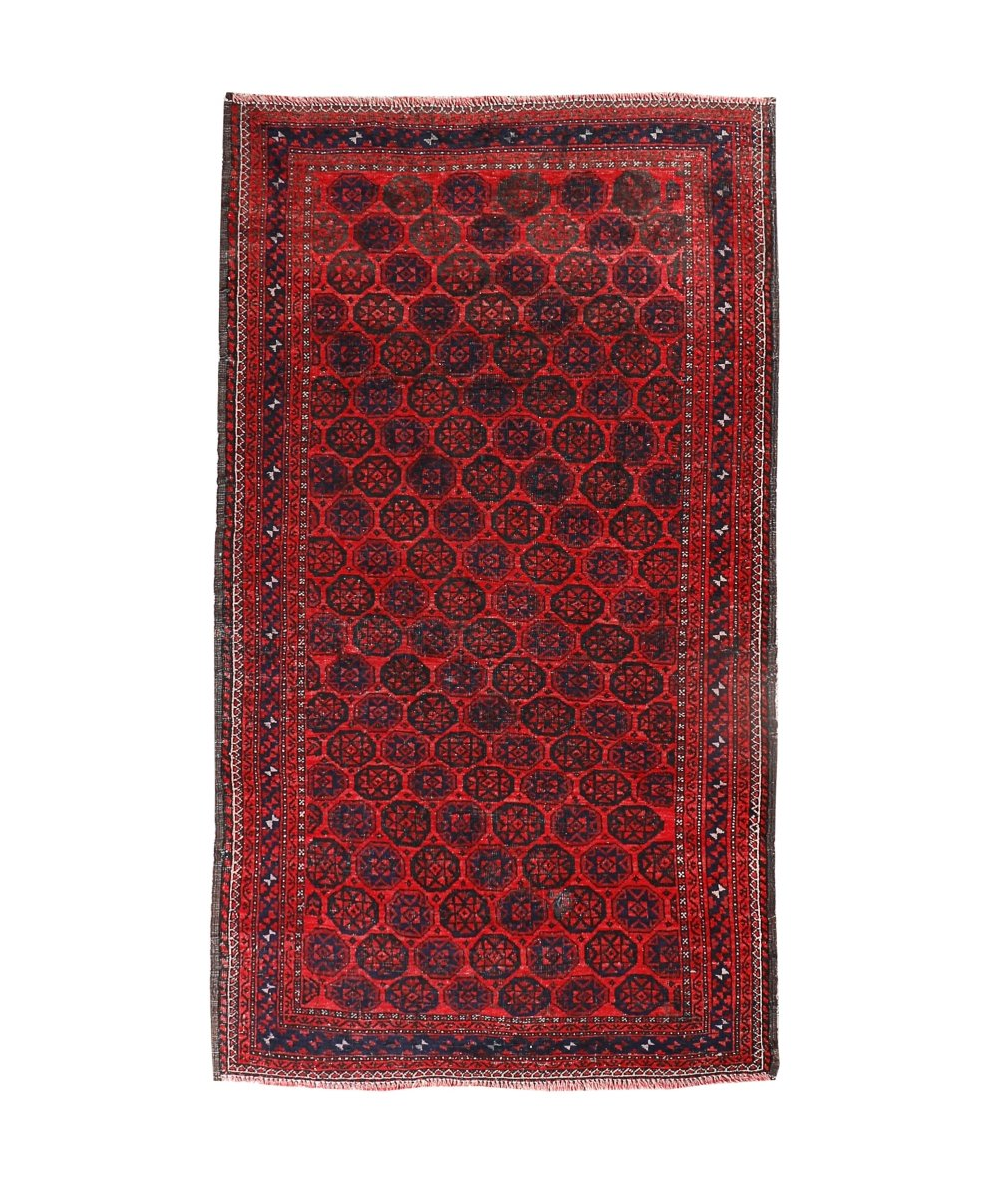 Persian Baluch rug with red field and black geometric medallion pattern, border trim
