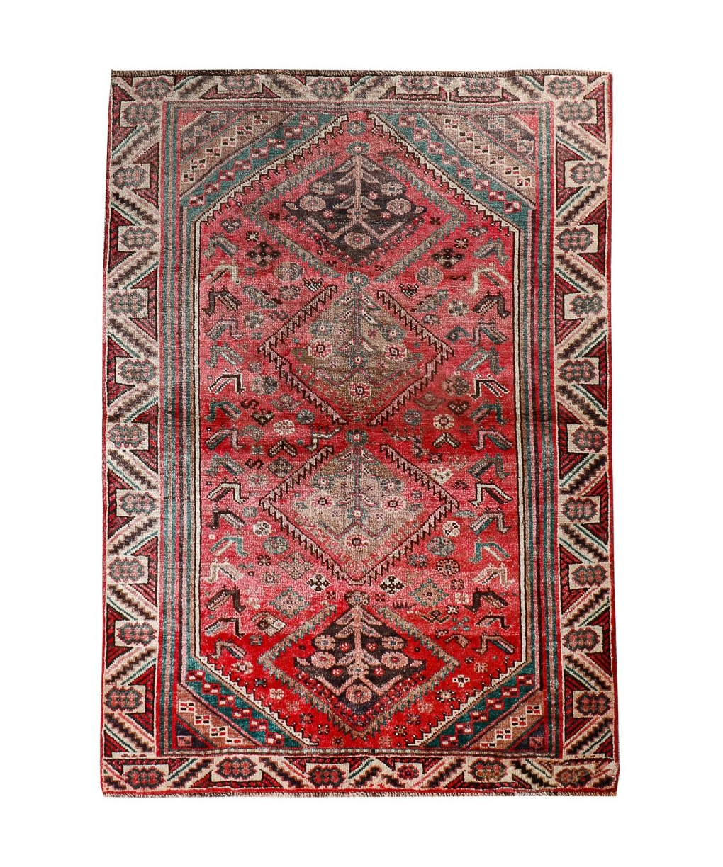 Persian Shiraz rug with red field and central medallion, teal and cream geometric pattern.