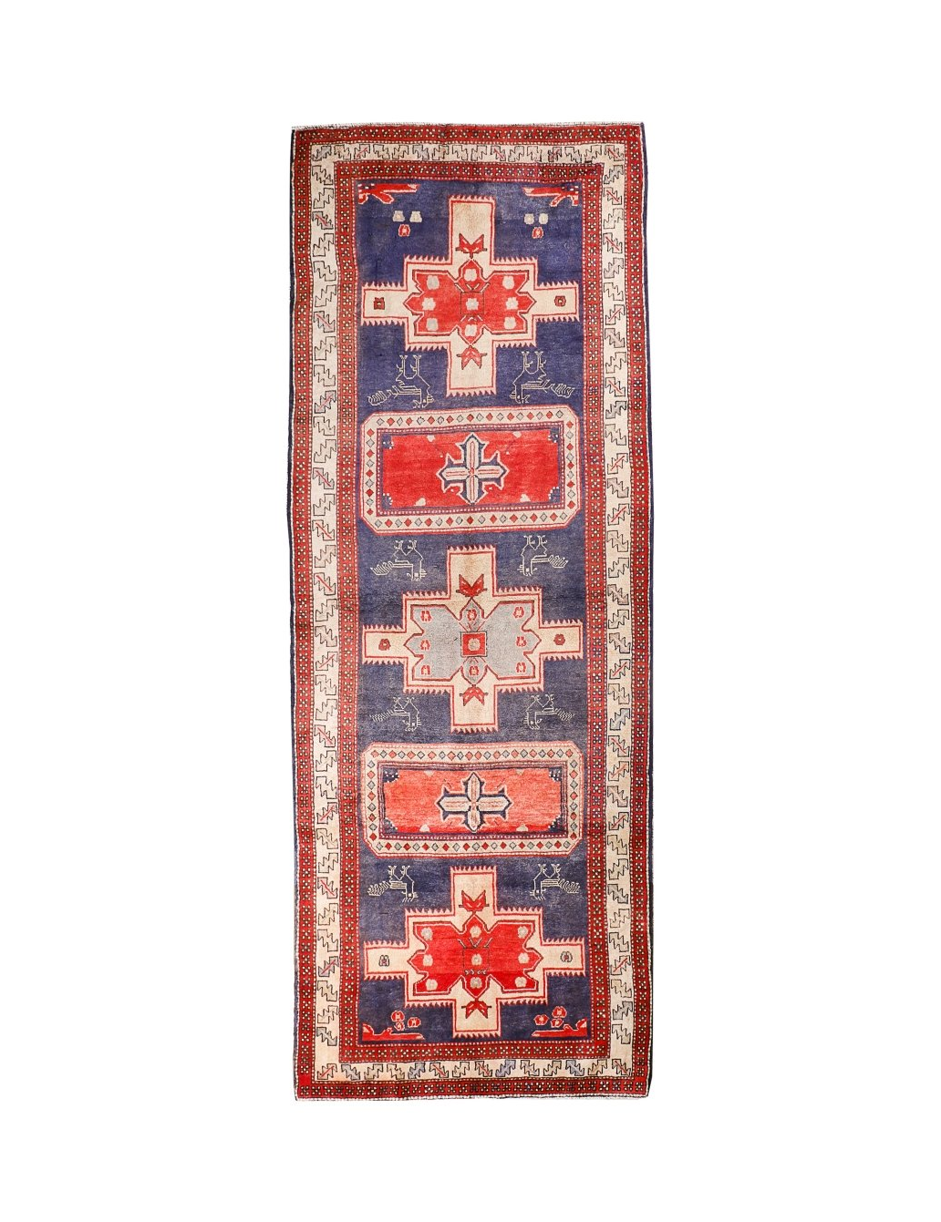 Persian runner rug with navy field, red border, and geometric medallion motifs.