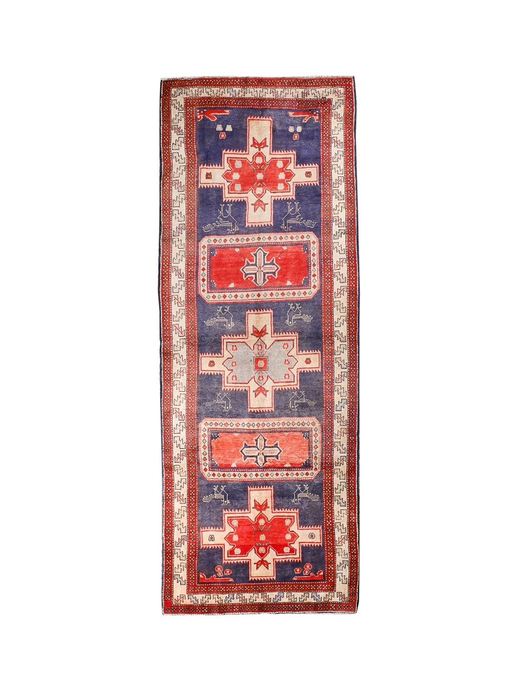 Persian runner rug with navy field, red border, and geometric medallion motifs.