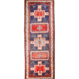 Persian runner rug with navy field, red border, and geometric medallion motifs.