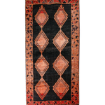 Persian Lori rug with black center and rust geometric diamond medallions