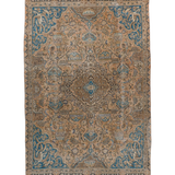 Persian rug with central medallion and blue patterns on tan ground