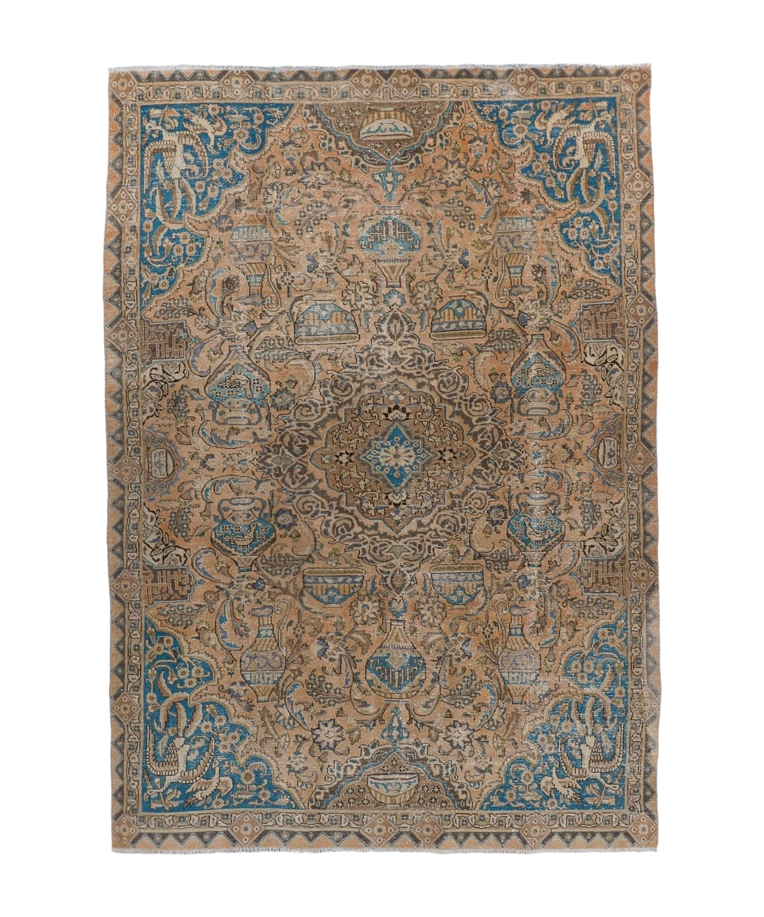 Persian rug with central medallion and blue patterns on tan ground