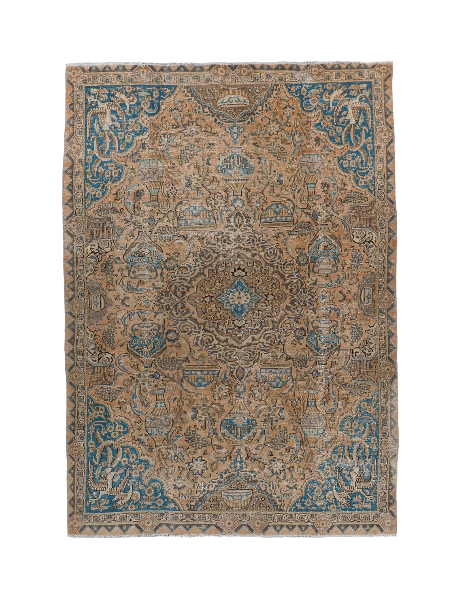 Persian rug with central medallion and blue patterns on tan ground