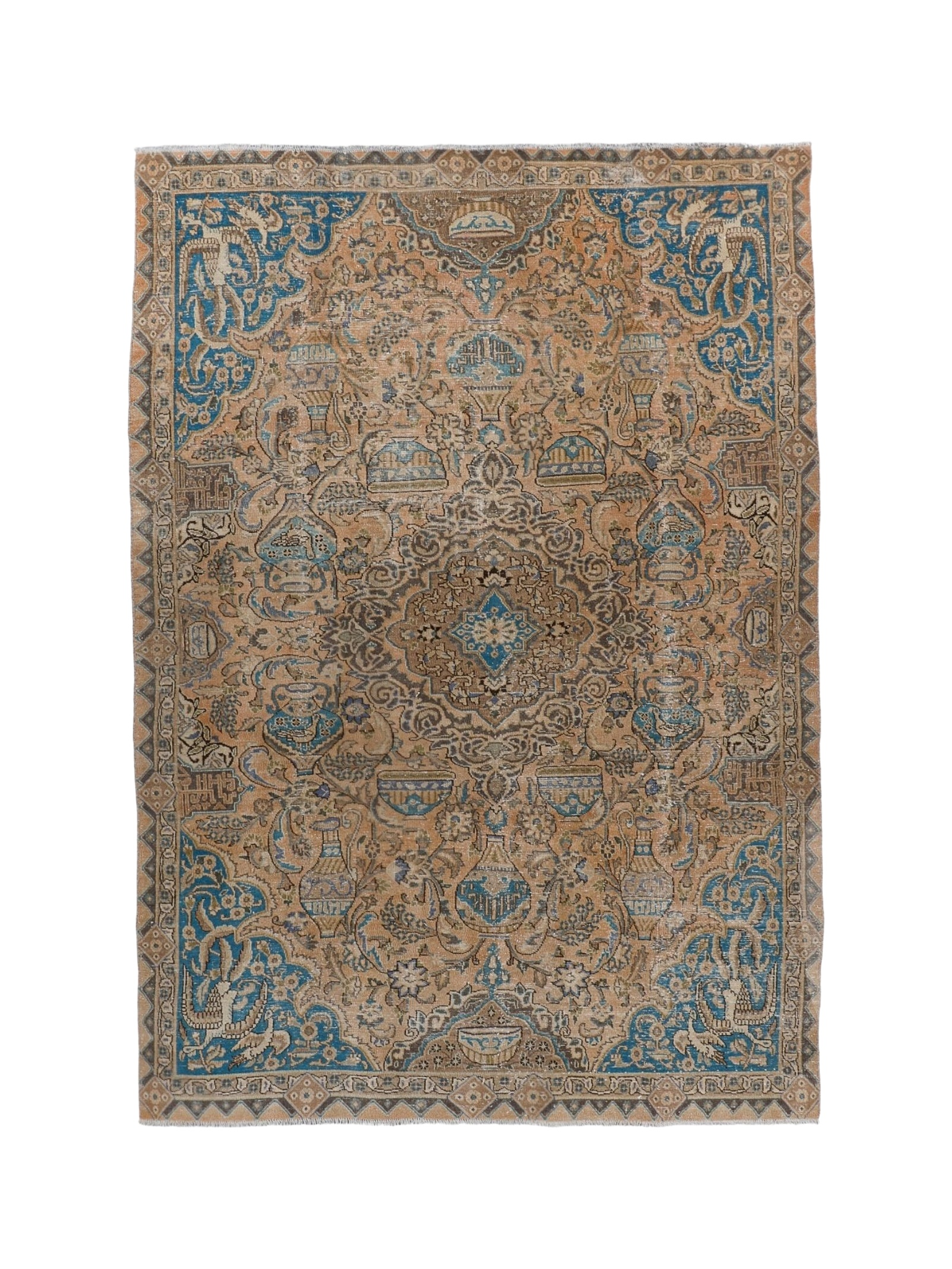 Persian rug with central medallion and blue patterns on tan ground