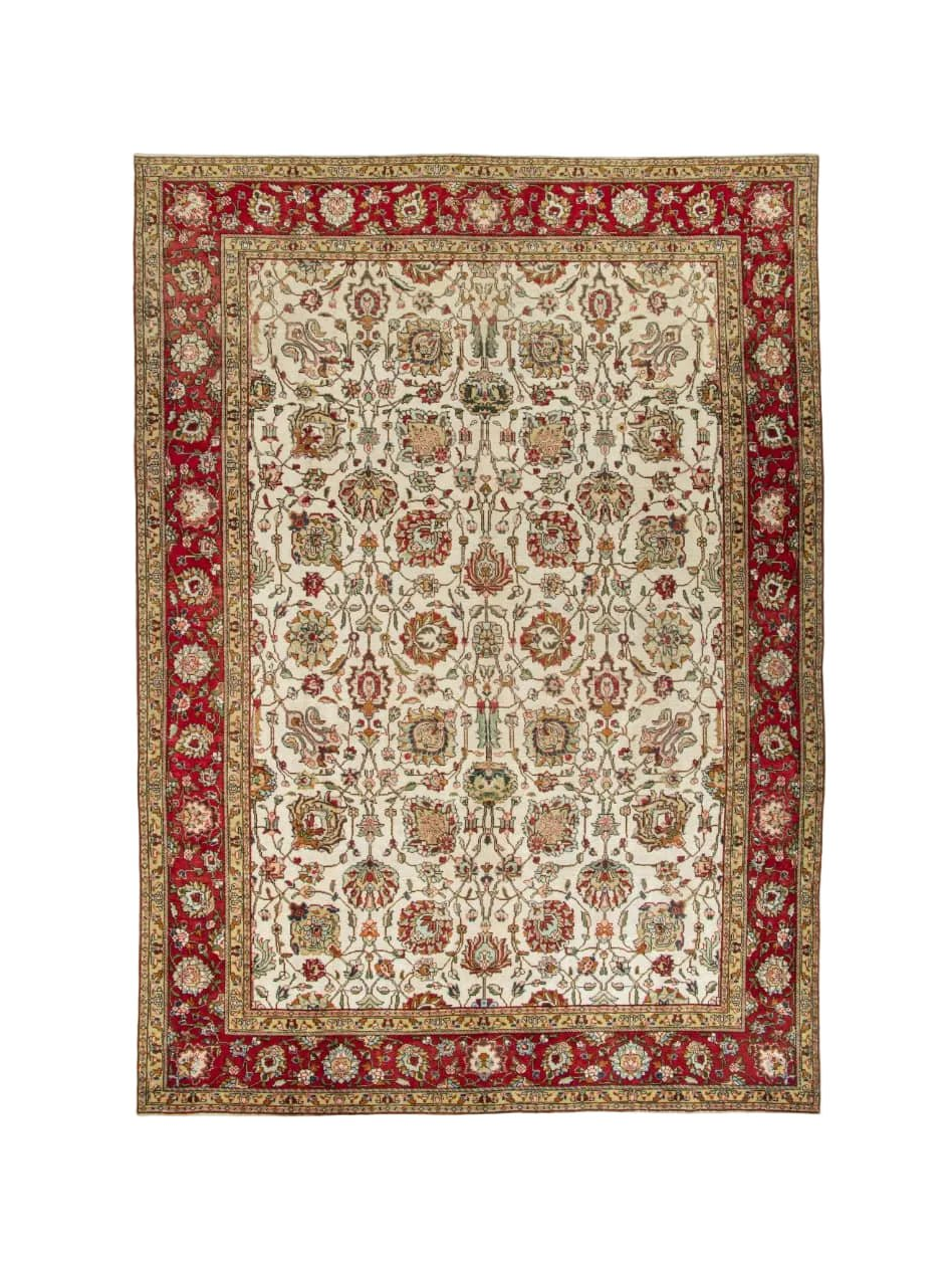Persian Tabriz rug, full view with red border and beige medallion pattern