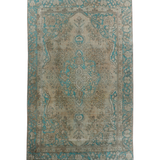 Persian Tabriz rug with beige center and teal border, ornate medallion pattern