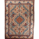 Persian Tabriz rug, symmetric floral medallion design in blue, teal, and rust tones