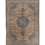 Full Persian-style rug in blue, beige, and orange with ornate central medallion border