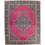 Persian Ardabil rug with pink field, navy border, and central geometric medallion