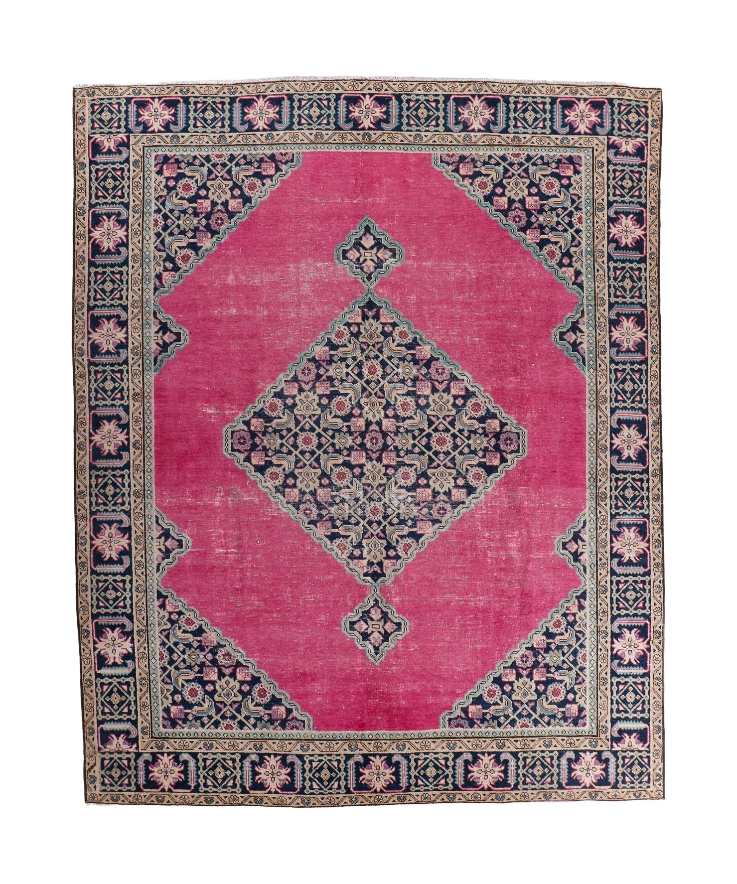 Persian Ardabil rug with pink field, navy border, and central geometric medallion