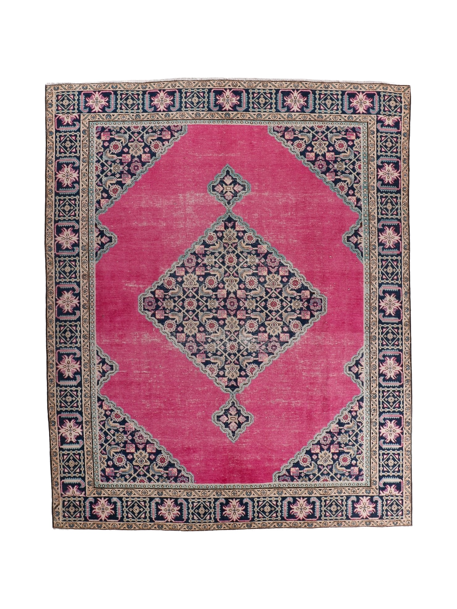 Persian Ardabil rug with pink field, navy border, and central geometric medallion