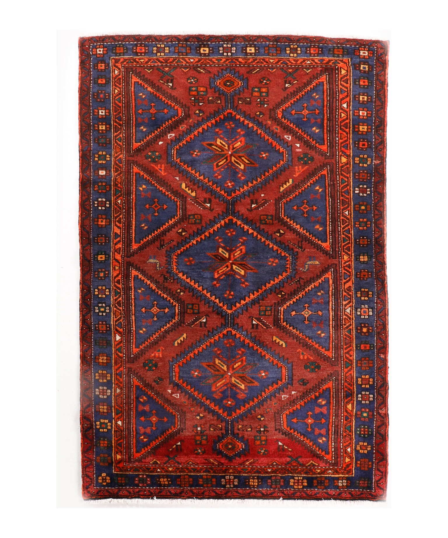 Persian Hamadan rug with red center medallion, navy corners, and patterned border