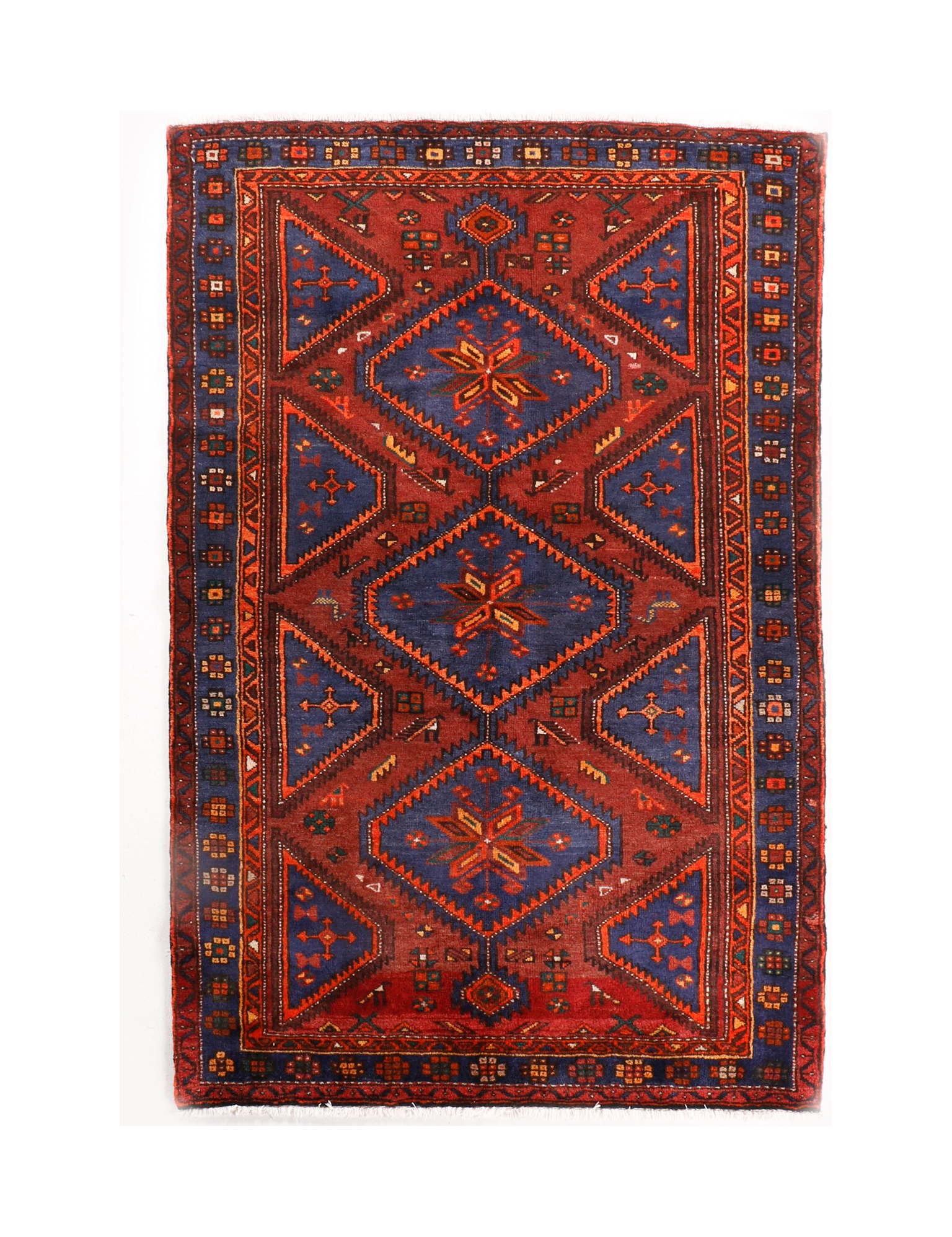 Persian Hamadan rug with red center medallion, navy corners, and patterned border