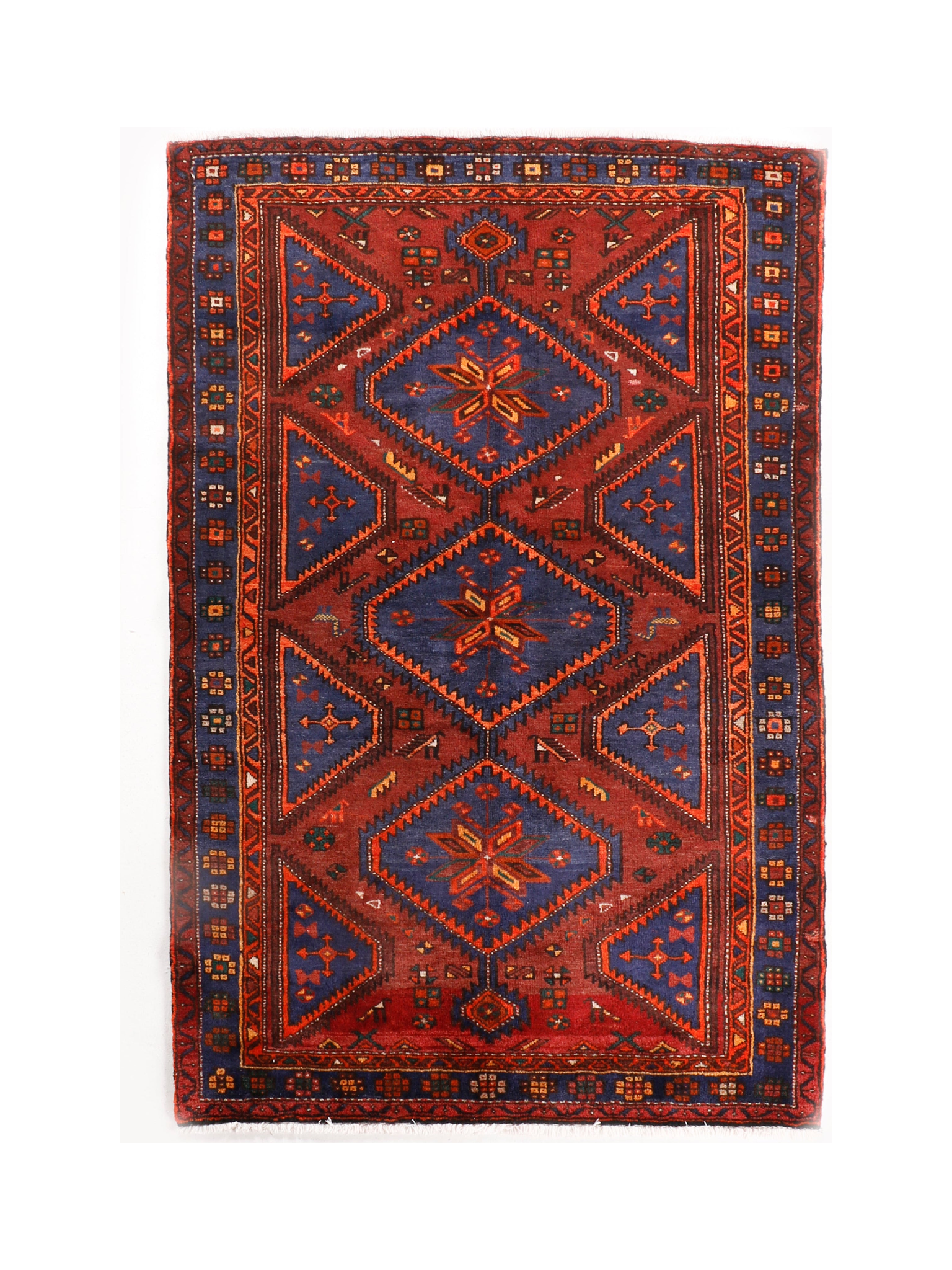 Persian Hamadan rug with red center medallion, navy corners, and patterned border