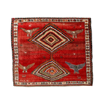 Red Persian-style rug with diamond medallion, birds, and multicolor border design.