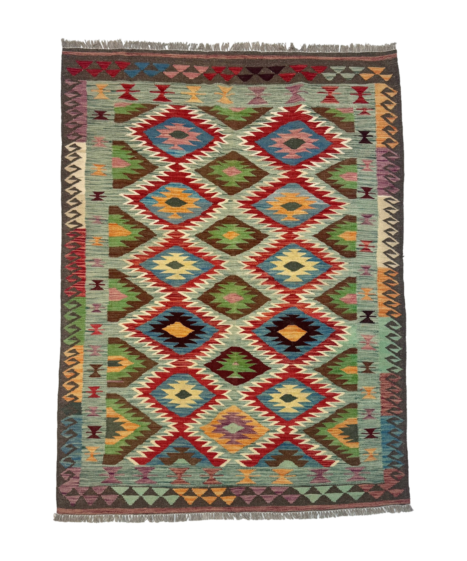 Rectangular kilim rug with repeating diamond medallions in red, teal, green, and yellow; fringed.