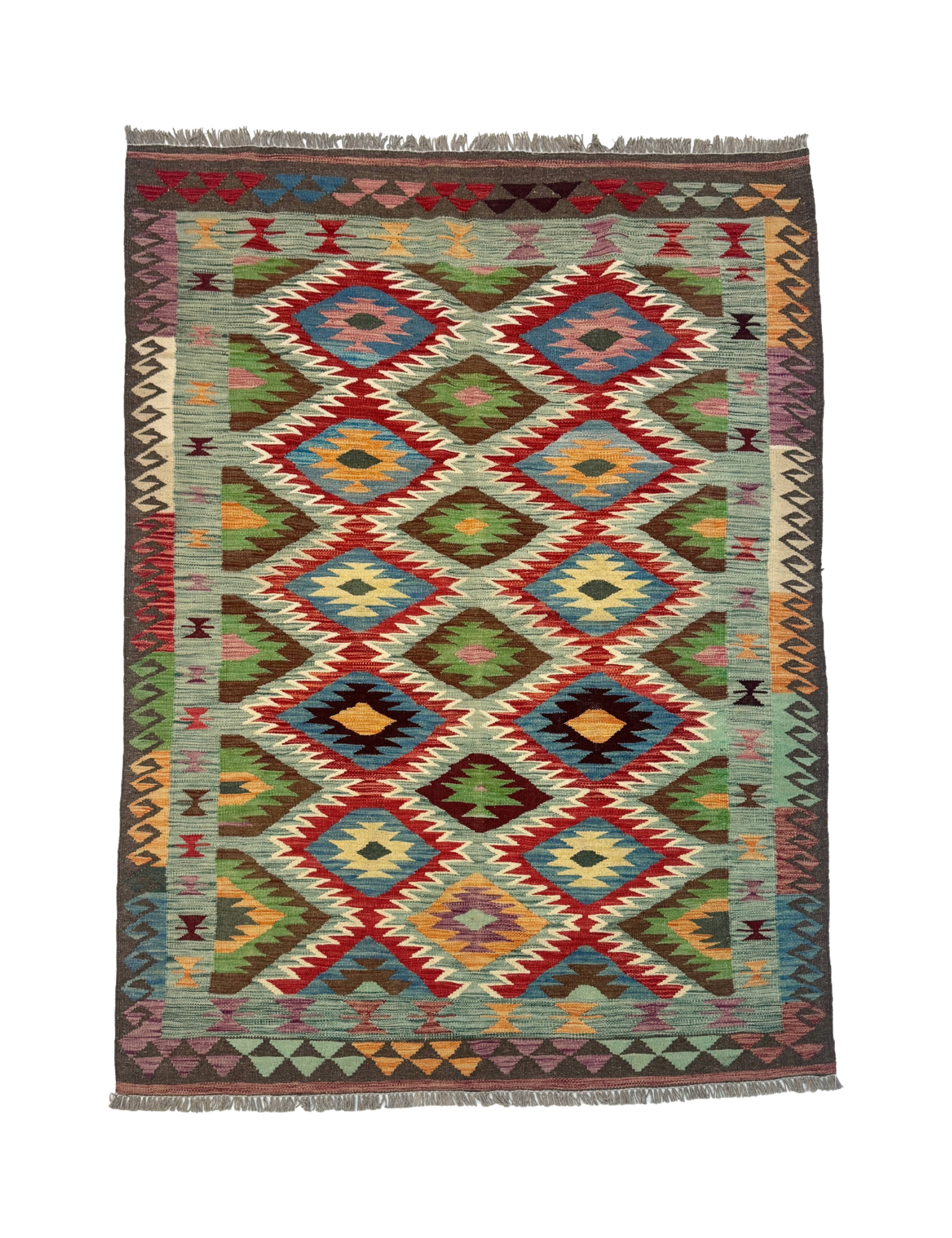 Rectangular kilim rug with repeating diamond medallions in red, teal, green, and yellow; fringed.