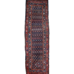 Navy blue runner rug with red and tan geometric borders, rectangular traditional pattern