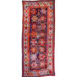 Kazak-style runner rug with red, navy, cream geometric medallion and side borders