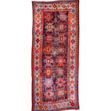 Kazak-style runner rug with red, navy, cream geometric medallion and side borders
